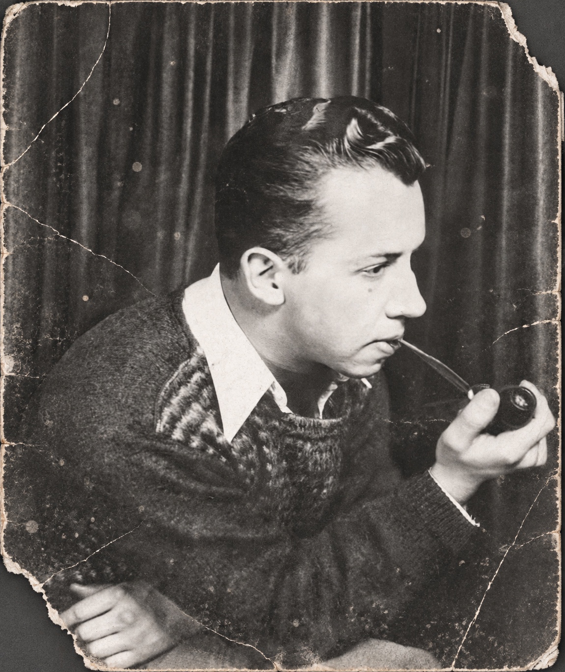 Damaged black-and-white portrait before restoration