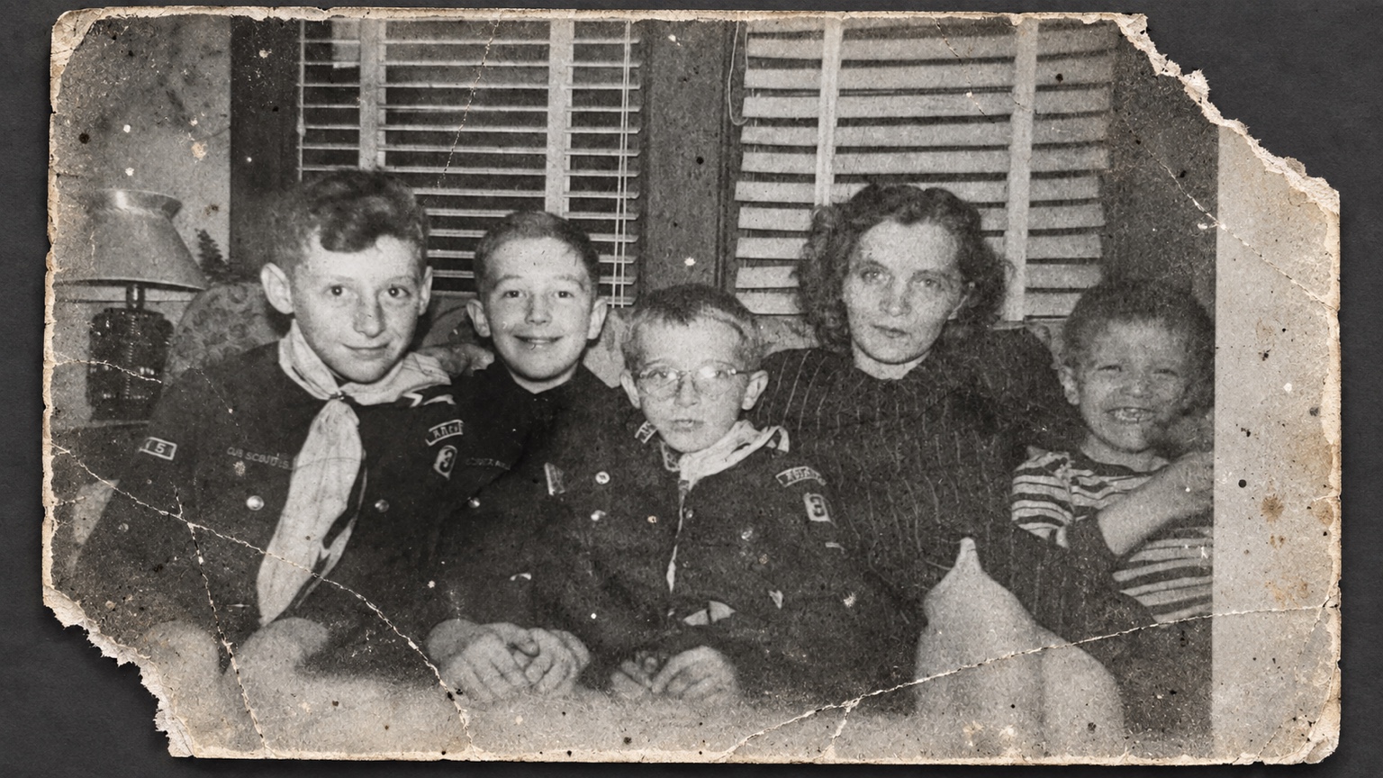 Damaged family photograph before restoration