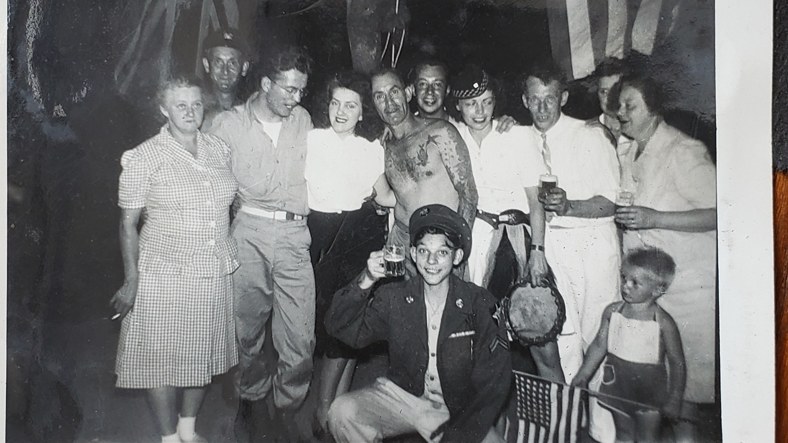Damaged black-and-white wedding group photograph before restoration