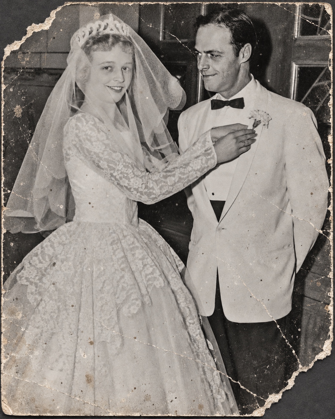 Damaged black-and-white bride and groom photograph before restoration